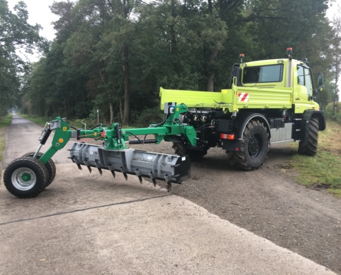 AG250 tractor-mounted grader (HEN technology) on Unimog